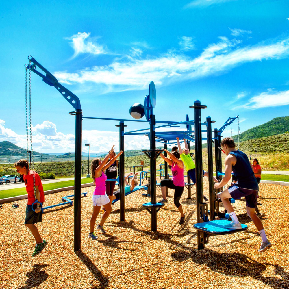 Outdoor movement coaching scene with space for bodyweight drills